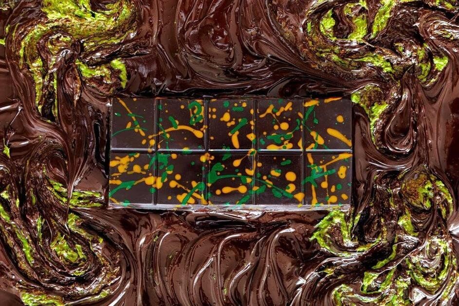 Slice of Dark Chocolate Knafeh topped with crispy golden pastry and rich melted chocolate drizzle.